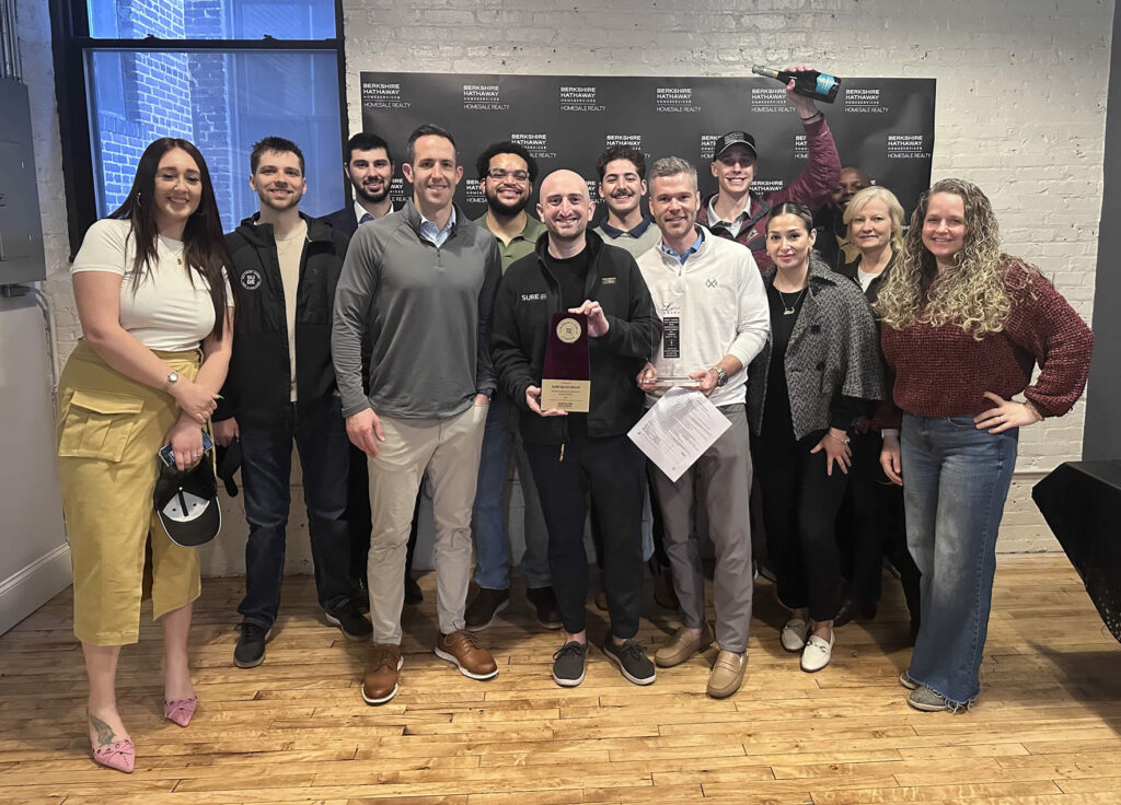 Sure Group Team winning award.